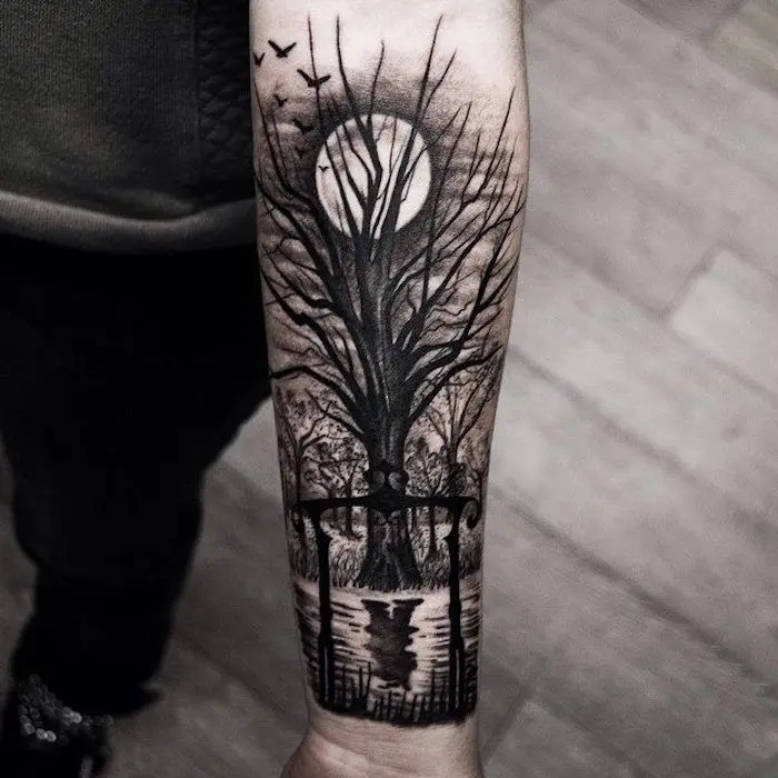 arboles y aves antebrazo tattoo - Qué significa el tatuaje de las ramas